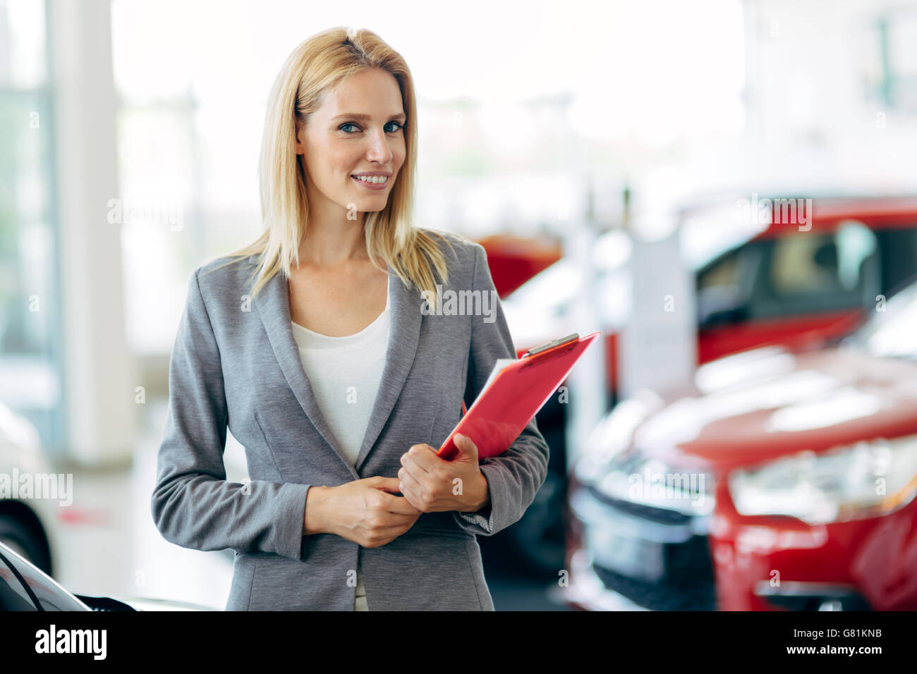 Professional salesperson working in car dealership Stock Photo Alamy