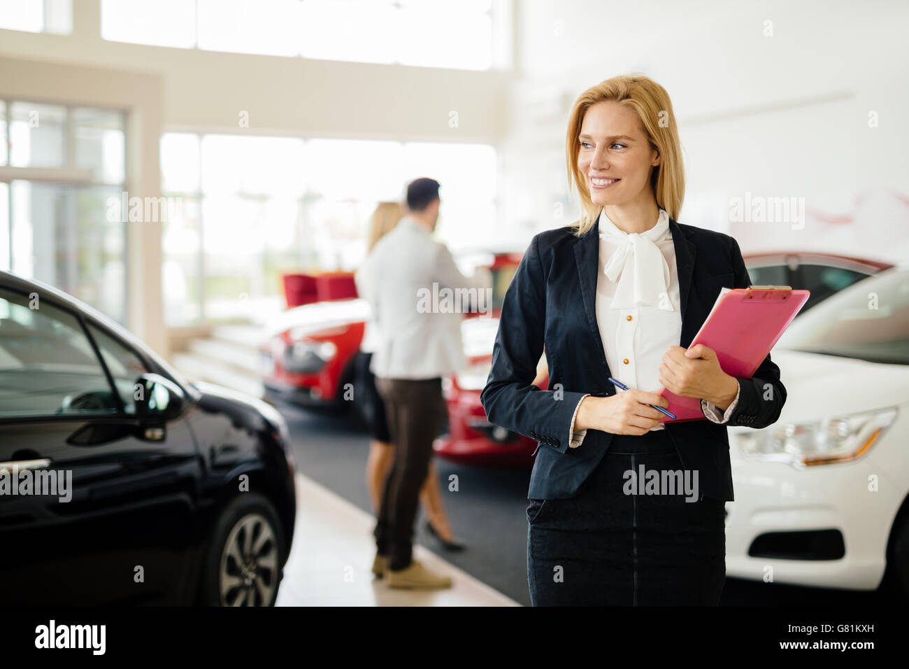 Professional salesperson working in car dealership Stock Photo Alamy