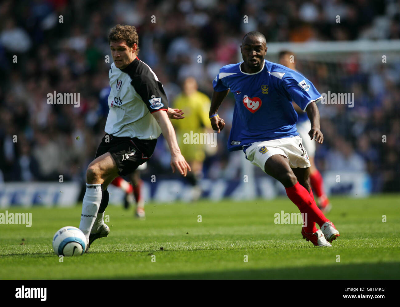 Soccer - FA Barclays Premiership - Fulham v Portsmouth - Craven Cottage. Fulham's Moritz Volz and Portsmouth's Lomana Lualua Stock Photo