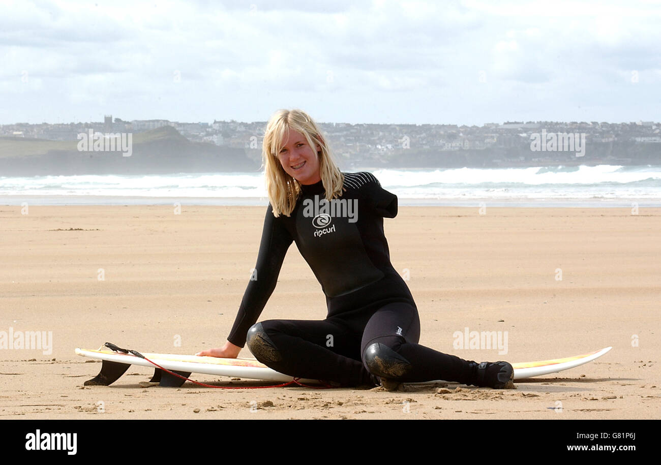 Bethany Hamilton, 15, before surfing in Watergate Bay, near Newquay, where she was teaching new Blue Peter presenter Gethin Jones, 26, to surf for a future episode of the children's TV programme. The teenage surfer from Hawaii lost her left arm when she was attacked by a 14ft tiger shark while she was surfing near Tunnels Beach on Kauai on October 31, 2003, when she was 13. Stock Photo