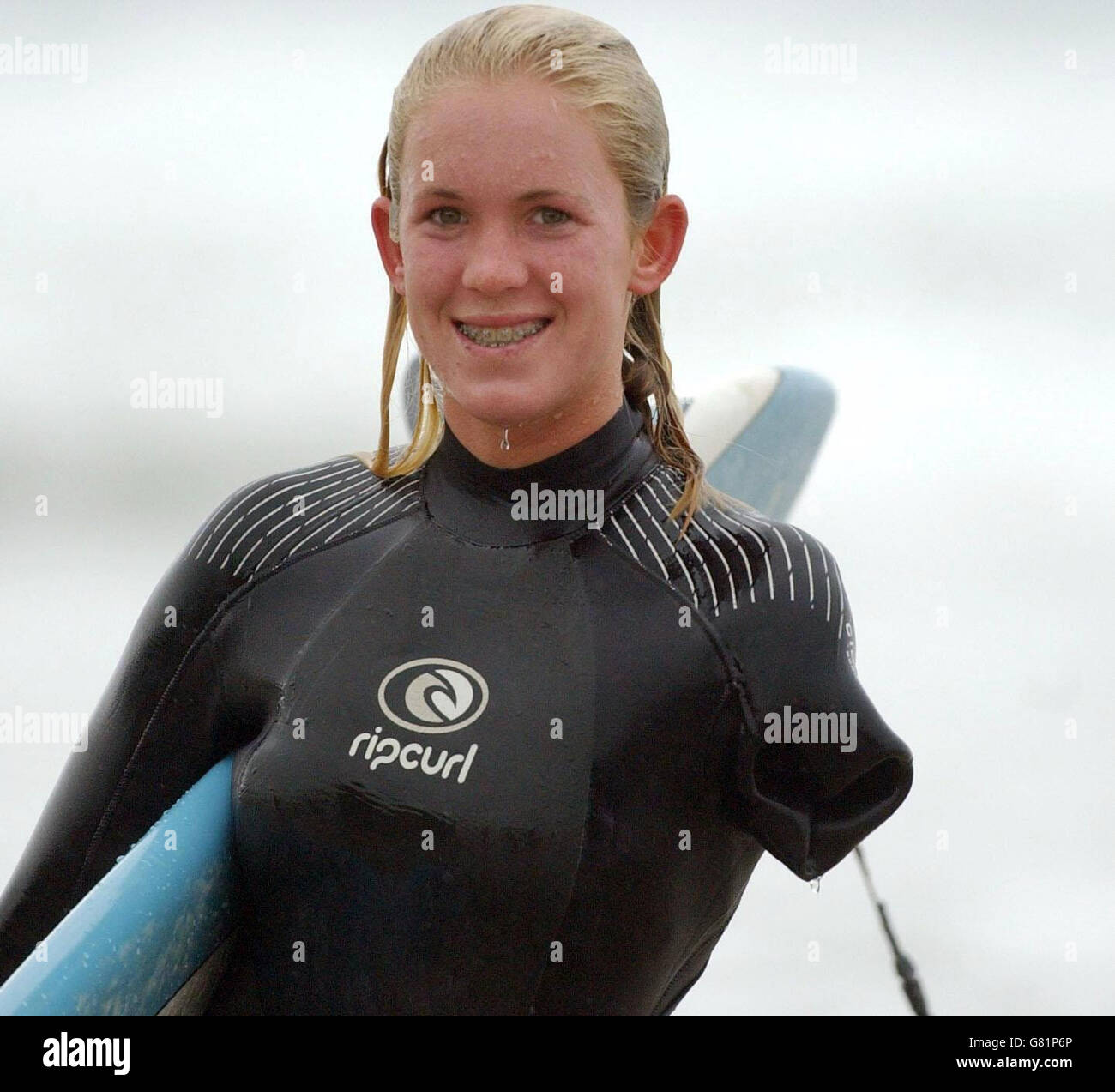 Bethany Hamilton, 15, after surfing in Watergate Bay, near Newquay, where she was teaching new Blue Peter presenter Gethin Jones, 26, to surf for a future episode of the children's TV programme. The teenage surfer from Hawaii lost her left arm when she was attacked by a 14ft tiger shark while she was surfing near Tunnels Beach on Kauai on October 31, 2003, when she was 13. Stock Photo