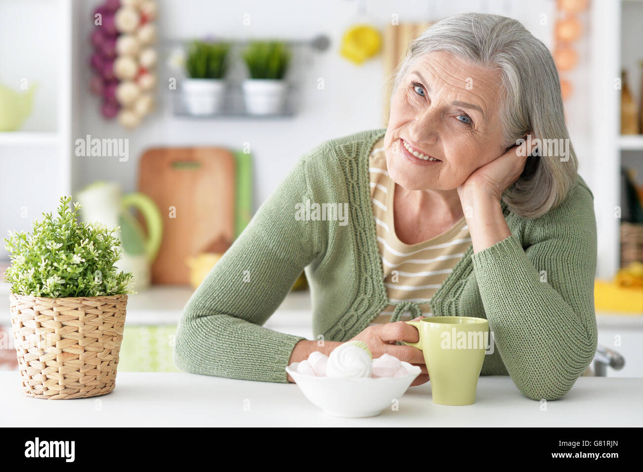 Mature grey haired woman and food hi-res stock photography and images ...