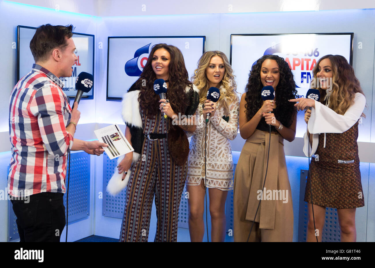 Capital FM presenter Greg Burns and Jesy Nelson, Perrie Edwards, Leigh-Anne  Pinnock and Jade Thirlwall from Little Mix during an interview at Capital FM  Summertime Ball Radio studio, Wembley Stadium, London. Daniel