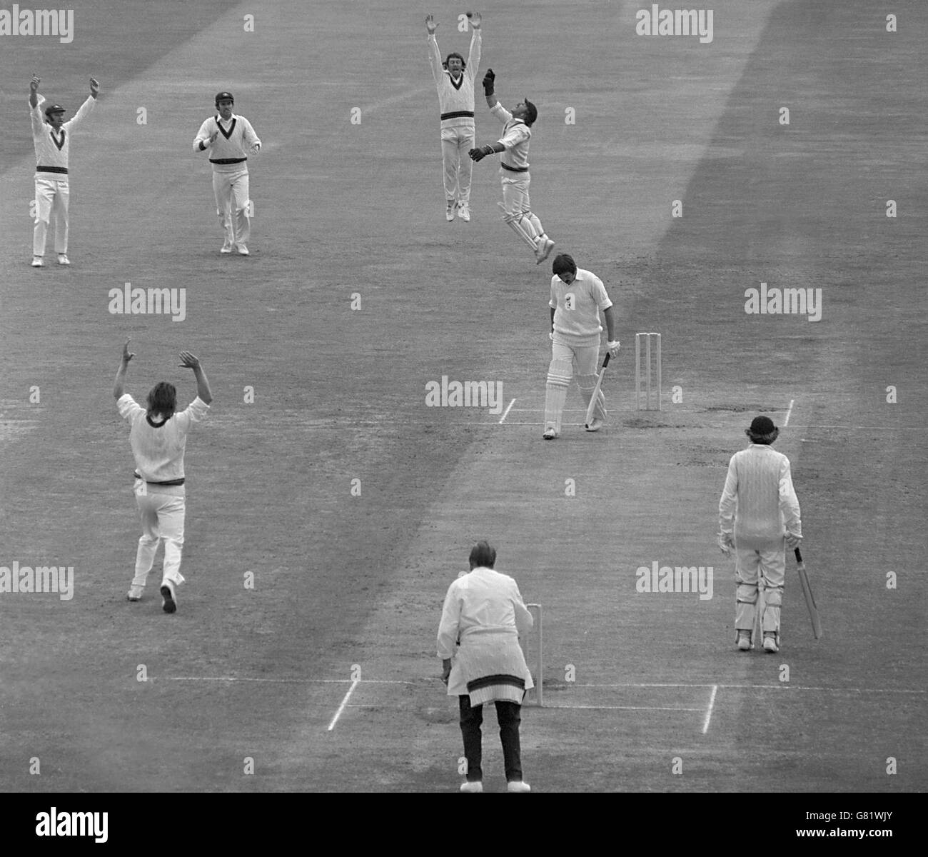 A sad walk for Graham gooch, out for nought after touching a Jeff Thomson out-swinger to Australian wicketkeeper Rodney Marsh in England's second innings. Stock Photo