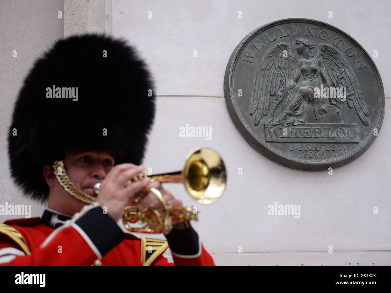 Lance Corporal Nick Walkley plays the Last Post after the unveiling of a memorial in honour of the thousands of soldiers who fought and died in the Battle of Waterloo at Waterloo Station, London, to mark the event's 200th anniversary. Stock Photo