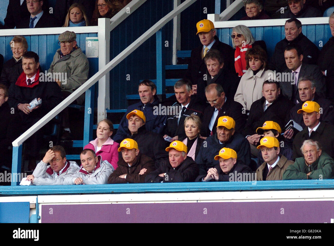 Charlton Athletic Directors wearing yellow caps in the Directors box