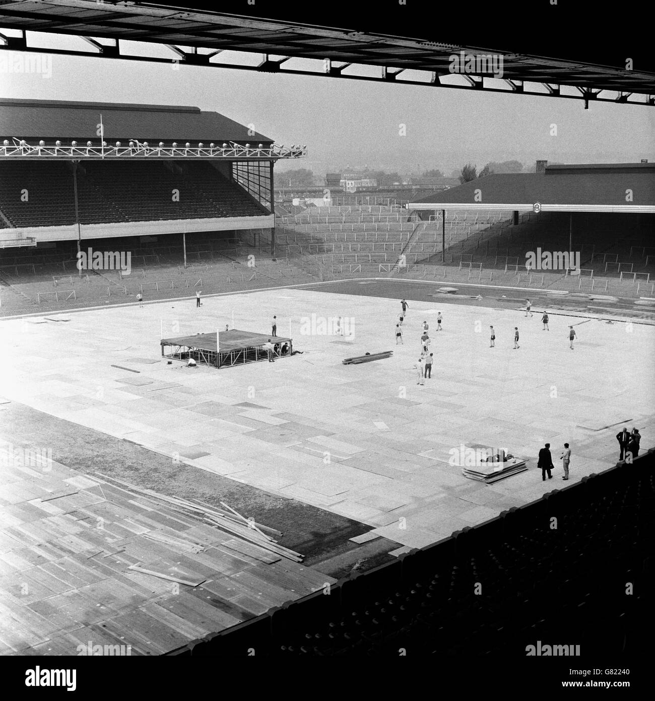 Boxing - World Heavyweight Championship - Muhammad Ali v Henry Cooper - Highbury - Preparations. The ring is erected in the middle of the Highbury pitch while an impromptu kickabout takes place on the covered surface Stock Photo