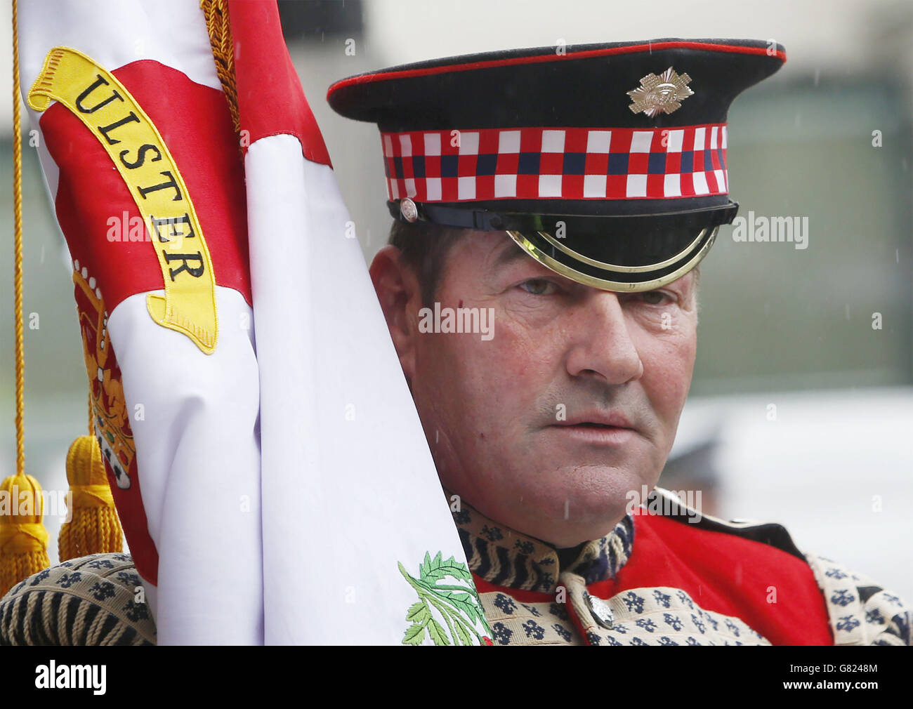 A member of the Black Skull flute band in George Square, Glasgow, during Orangefest. Stock Photo