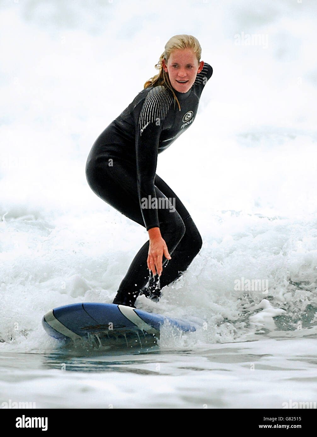 Bethany Hamilton, 15, on the beach at Watergate Bay, near Newquay, where she was teaching new Blue Peter presenter Gethin Jones, 26, to surf for a future episode of the children's TV programme. Stock Photo