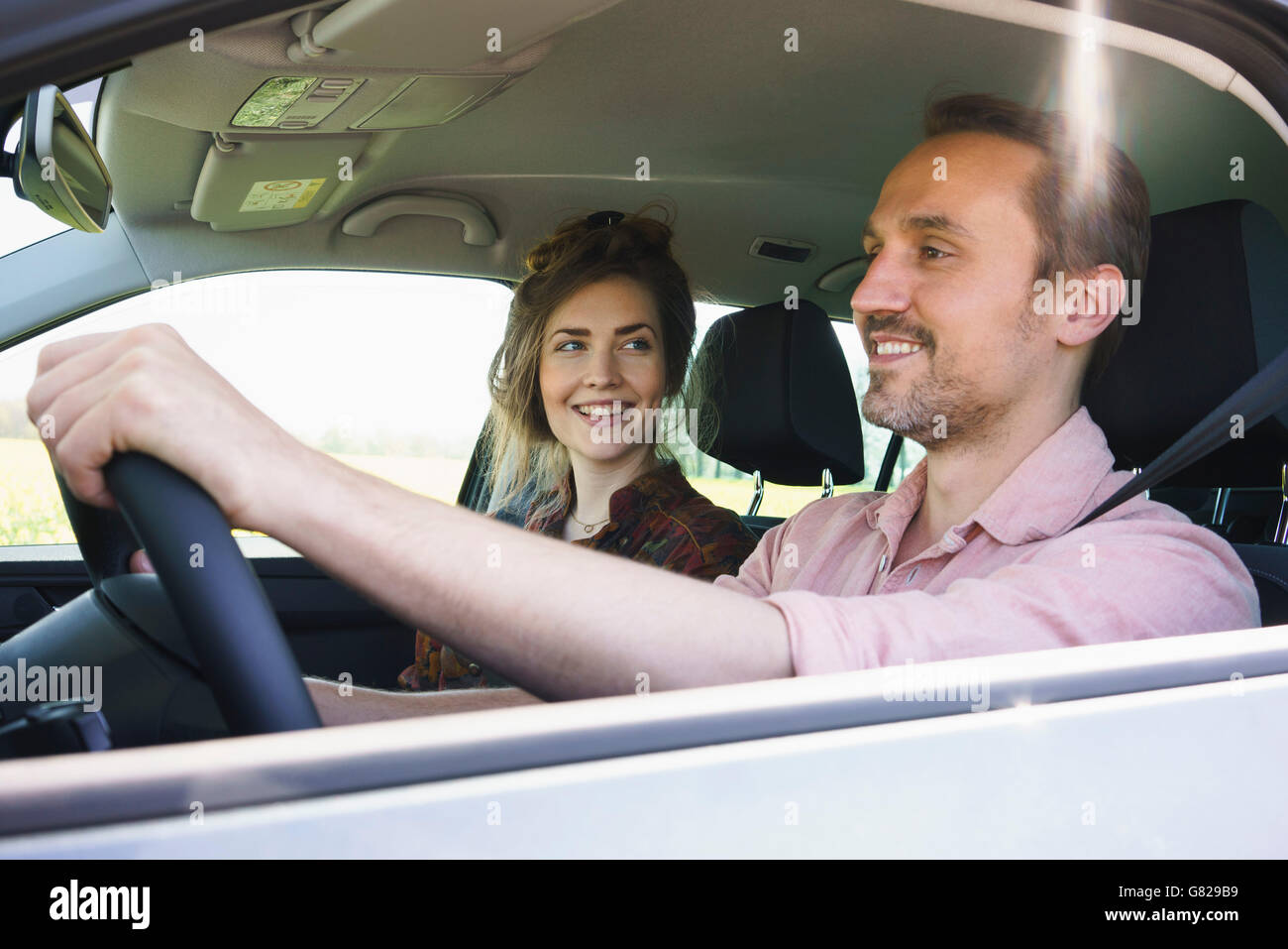 Happy couple sitting in car hi-res stock photography and images - Alamy