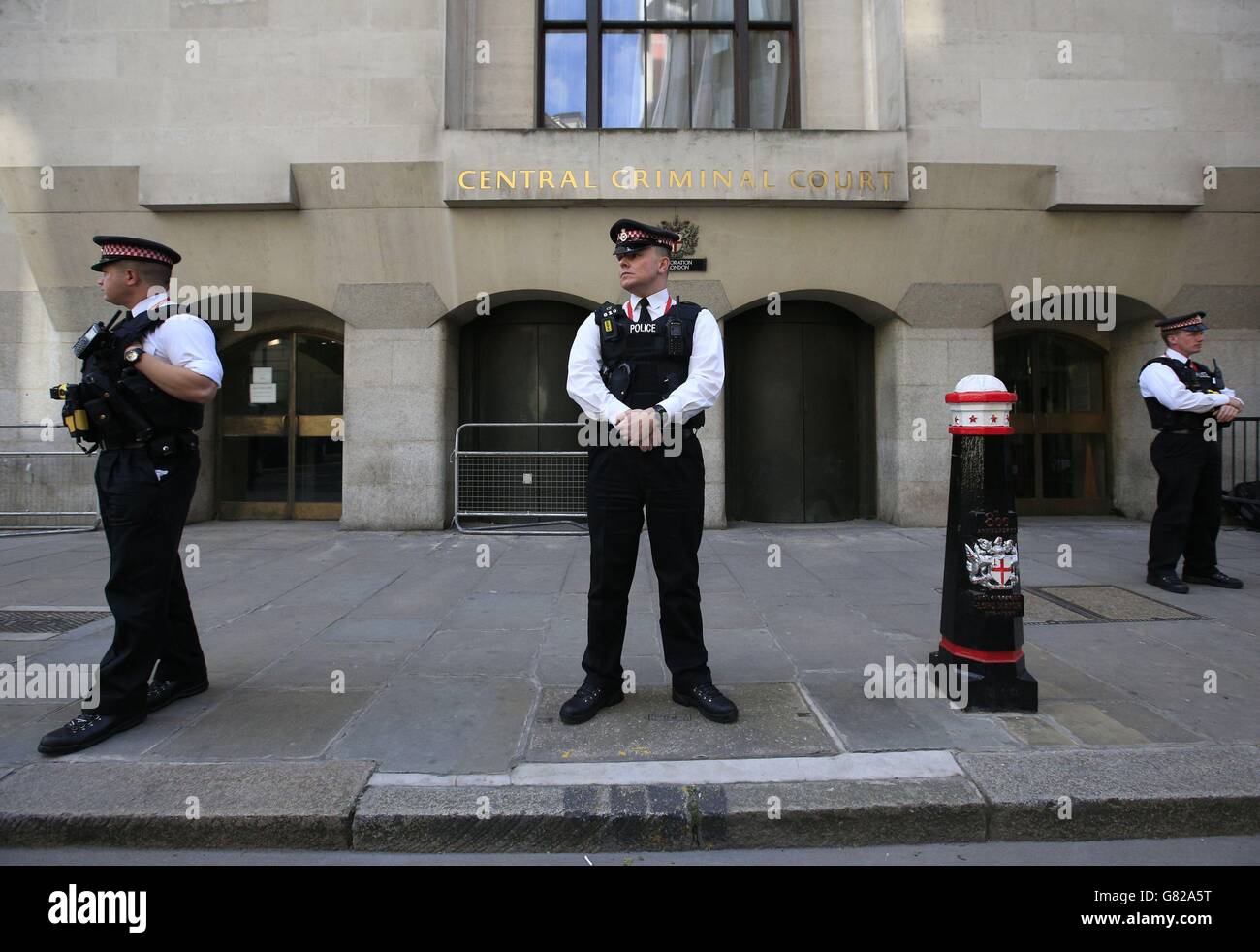 Police outside the Old Bailey, London, where ex-specialist firearms officer Anthony Long faces trial for the murder of robbery suspect Azelle Rodney. Stock Photo