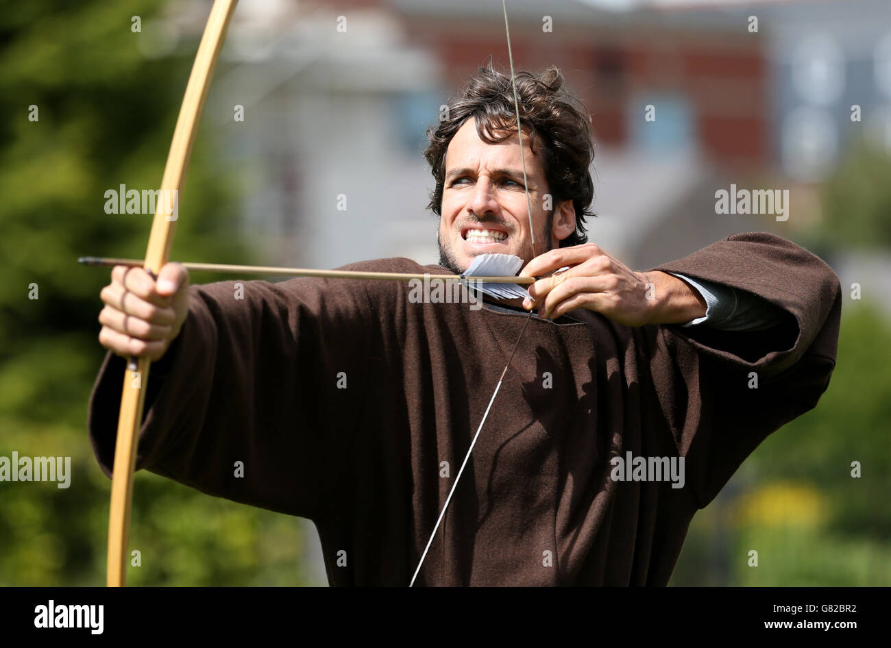 Spain's Feliciano Lopez receives an archery lesson during a photocall at Nottingham Castle, Nottingham. Stock Photo