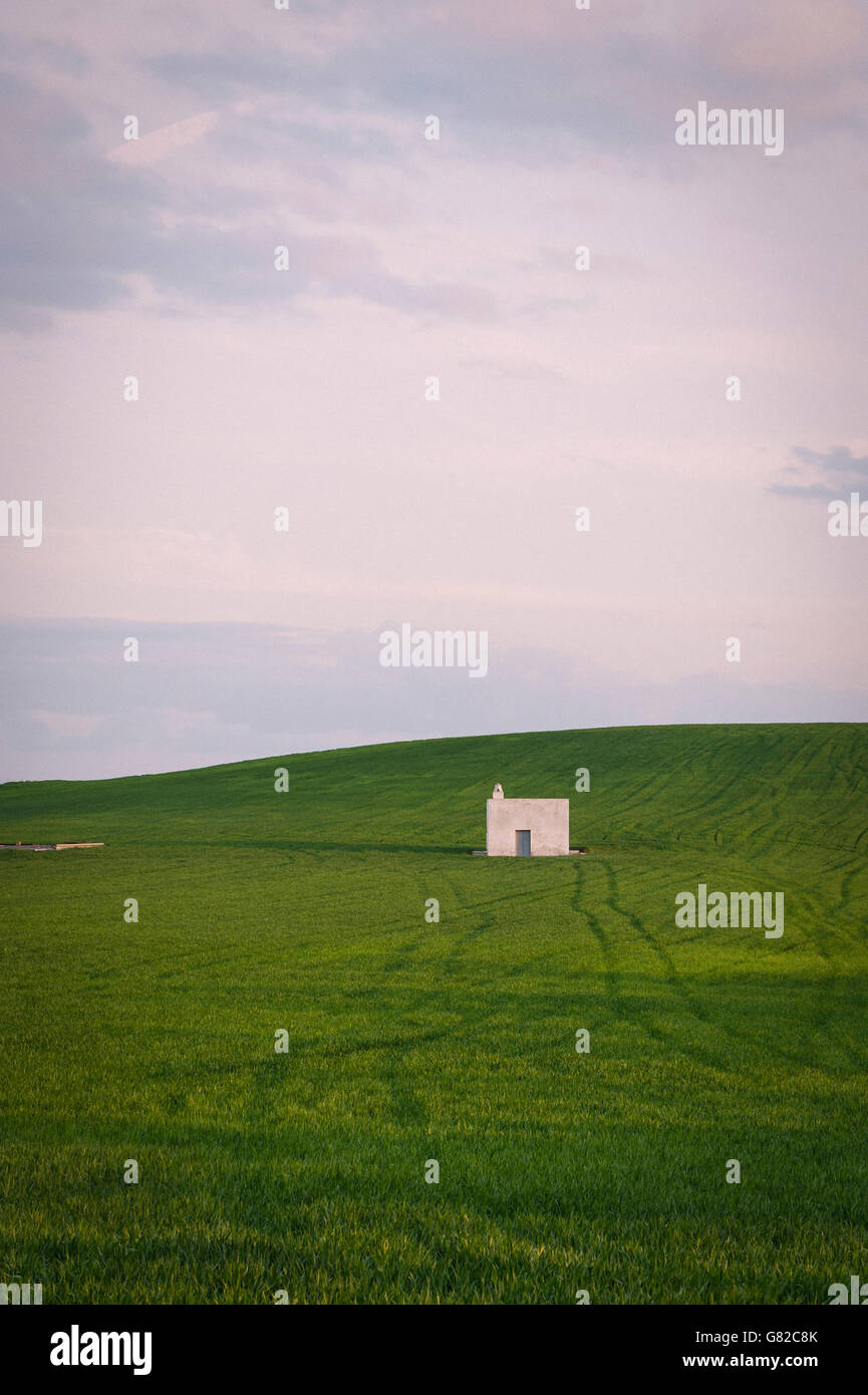 Distant view of built structure on field against sky Stock Photo