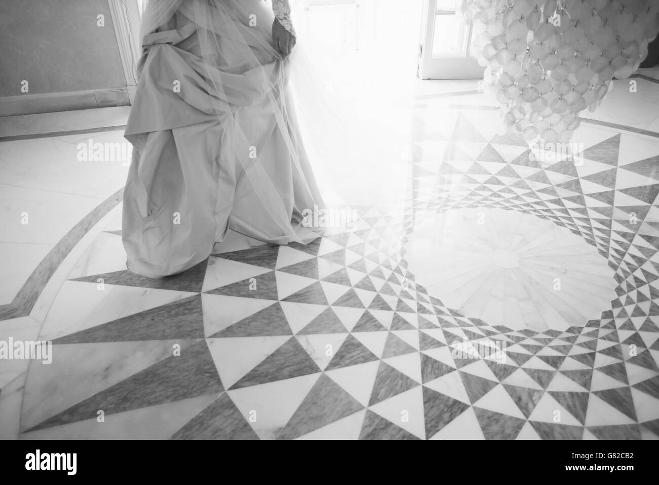 Low section of bride standing on patterned floor Stock Photo