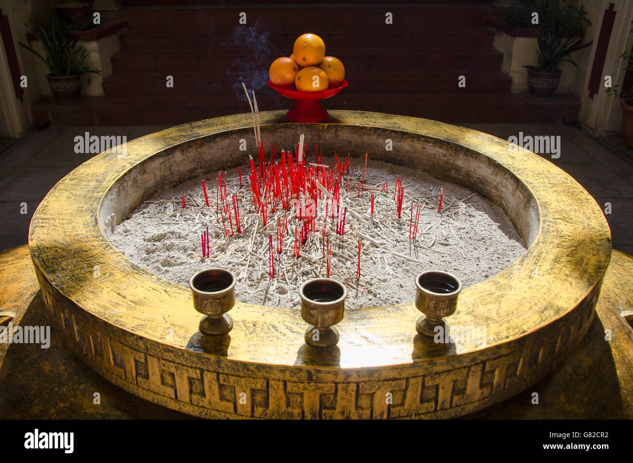 High angle view of incense sticks in container at temple Stock Photo