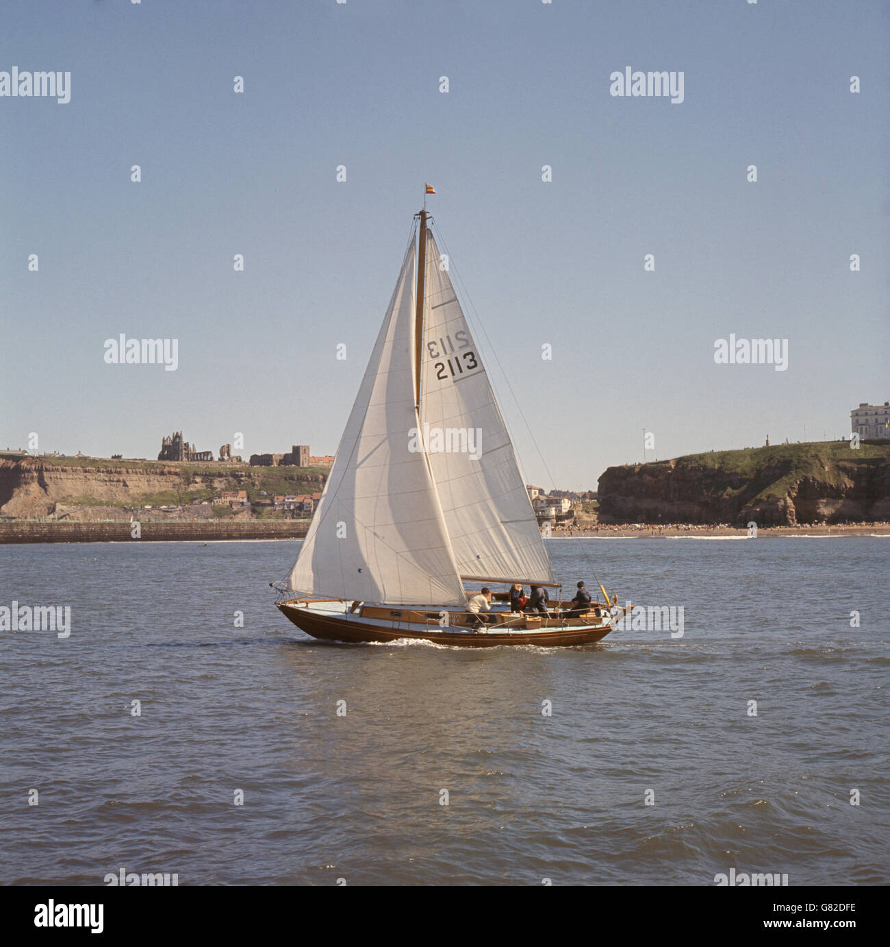 Yachting at Whitby. Blue skies and sunshine for yachtsmen at Whitby, Yorkshire, where craft are seen in a race organised by Whitby Yacht Club. Stock Photo