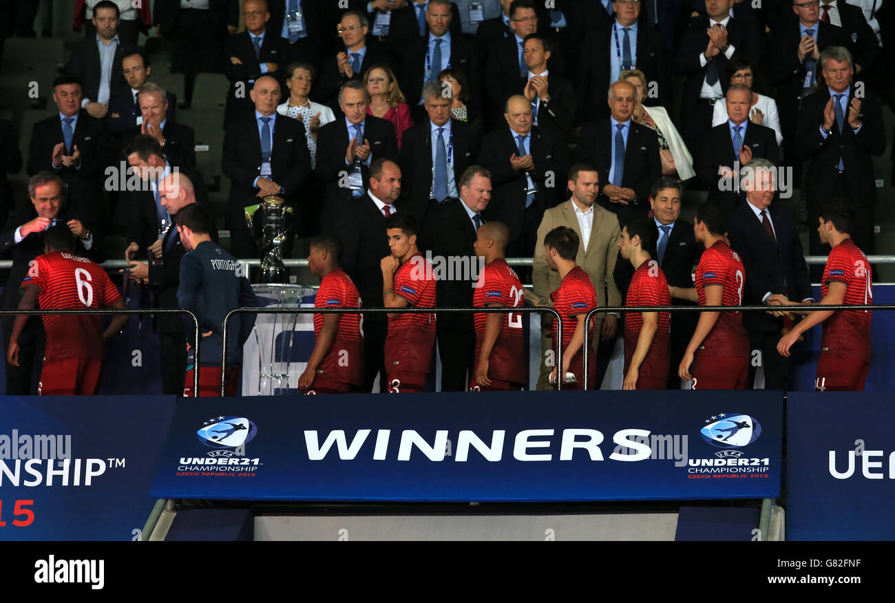 Portugal's William Carvalho (far left) collects his runners up medal from UEFA President Michel Platini along with his teammates Stock Photo