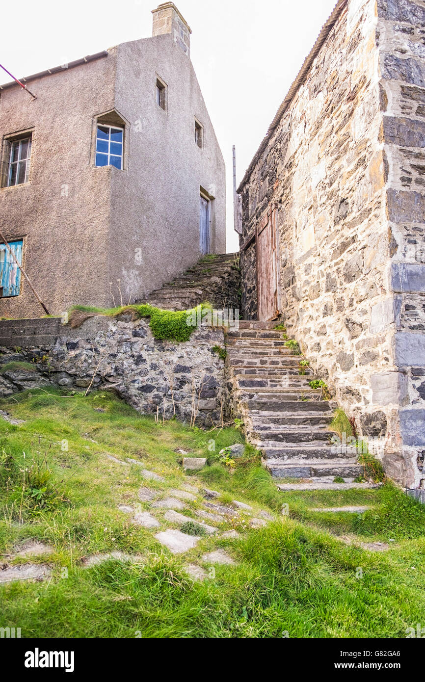 Traditional buildings and stone stairways of a Scottish fishing village Stock Photo