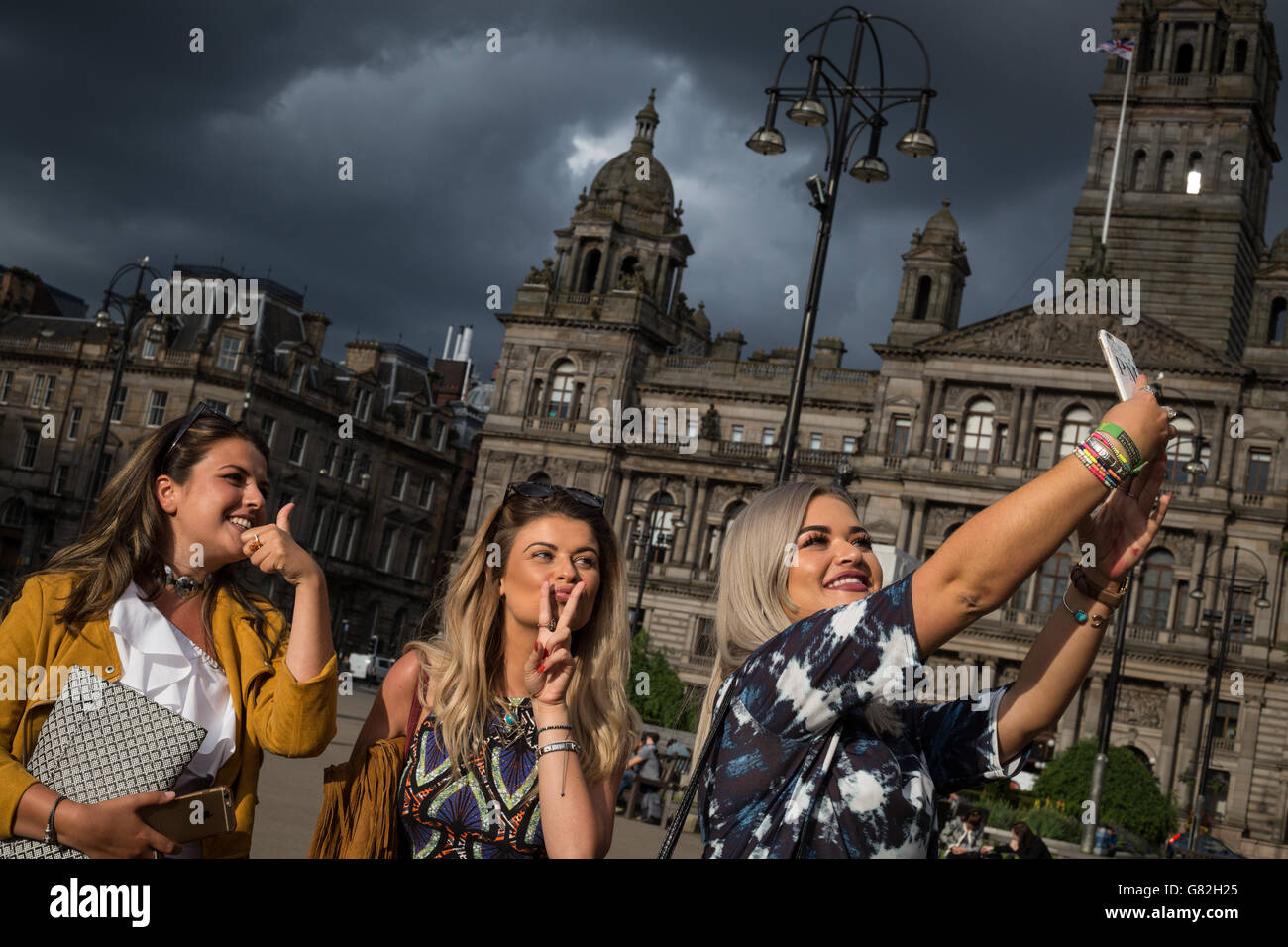 Glaswegian women taking a selfie photograph, using a smartphone, in Glasgow, Scotland,. Stock Photo
