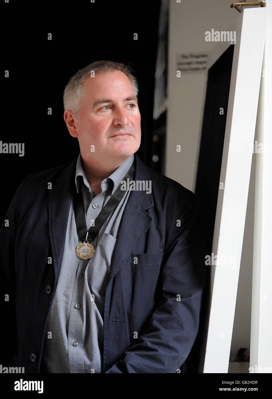 Author, illustrator and political cartoonist Chris Riddell poses for a