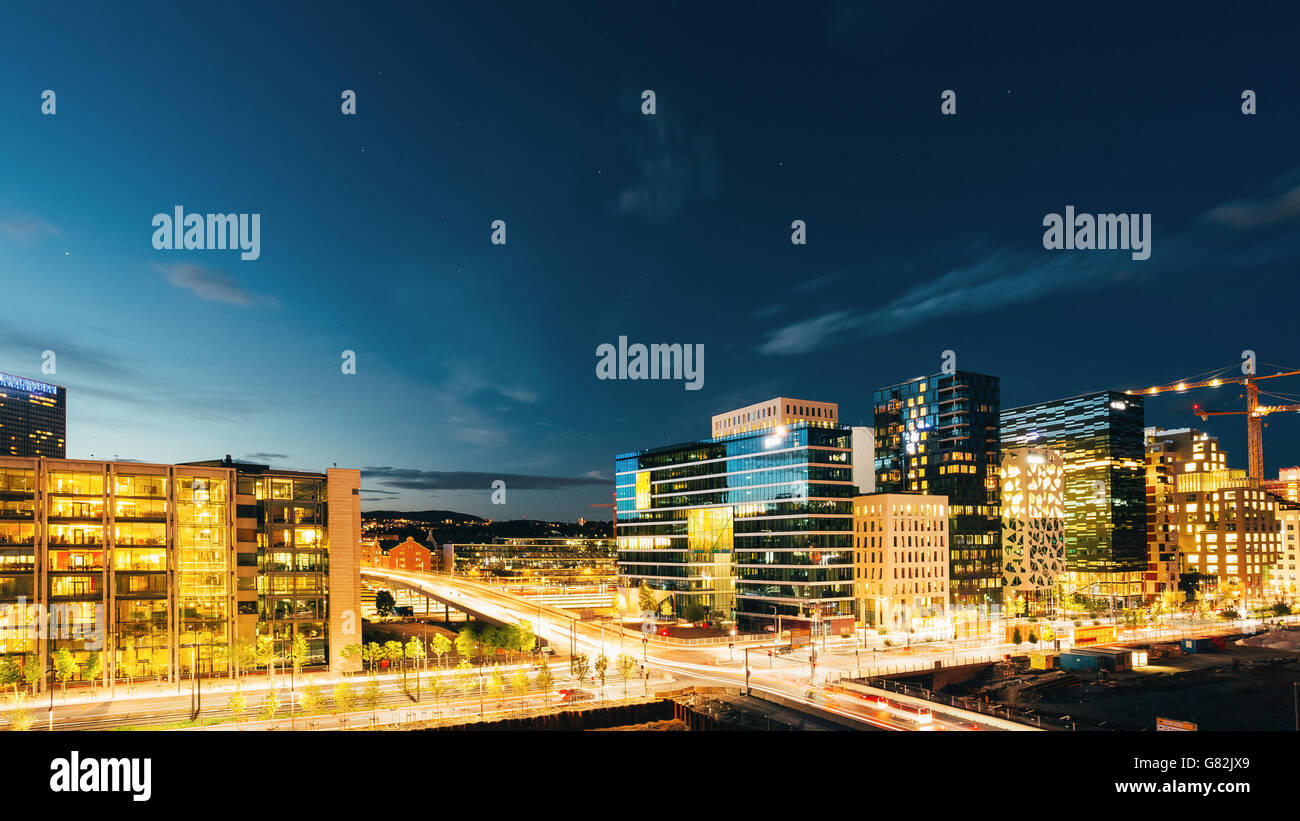 Night Panoramic View Of Street In The City Centers In Oslo, Norway. Summer Evening. Twilight, Day To Night. Construction Of Skys Stock Photo