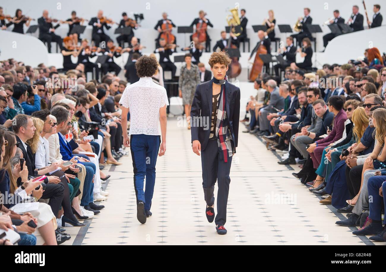 Models on the catwalk during the Burberry Prorsum catwalk show at Kensington Gardens, London, part of the British Fashion Council's London Collections: Men 2015. Stock Photo