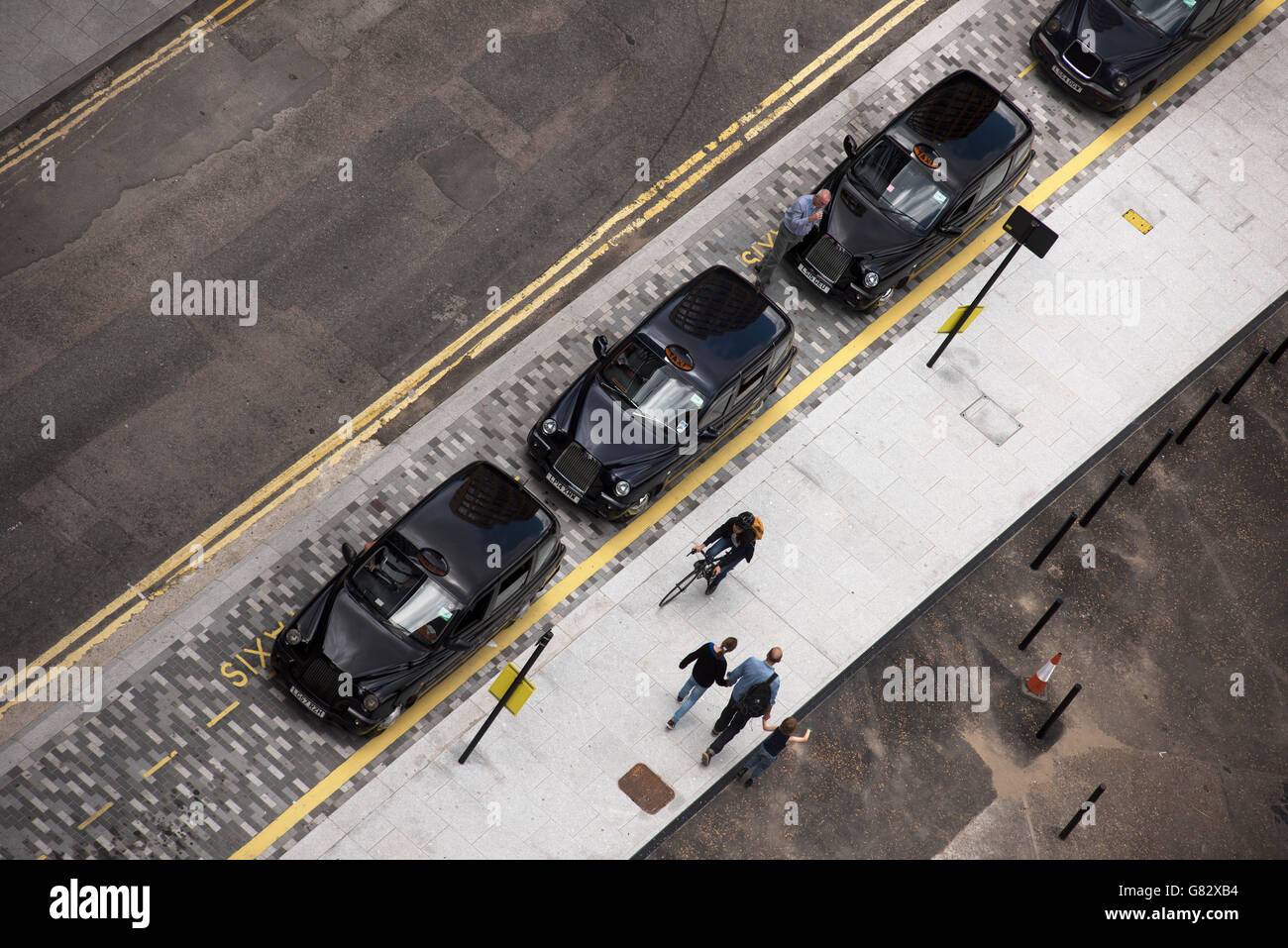 London and City of London panoramic view from Tate Modern Switch House roof observation terrace. London England. June 2016 Black Cab Taxi rank from above. Stock Photo