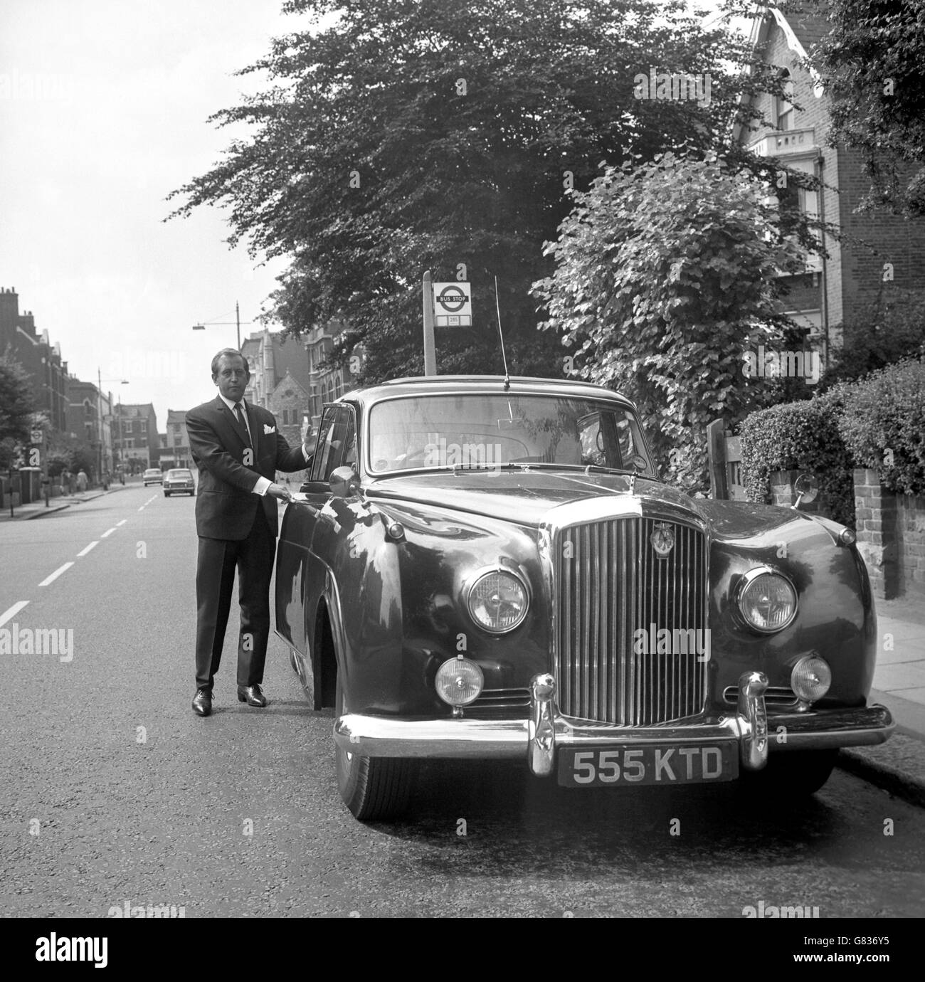 West End club proprietor Paul Raymond with his Bentley in London, after he had elected at Wimbledon to go for trial, charged with driving his car while under the influence of alcohol. Stock Photo