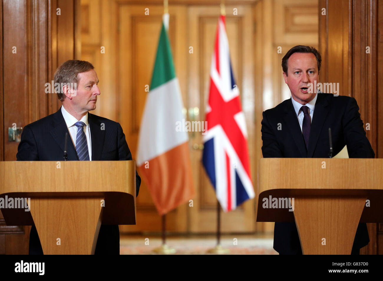 Irish Taoiseach Enda Kenny (left) and Prime Minister David Cameron hold