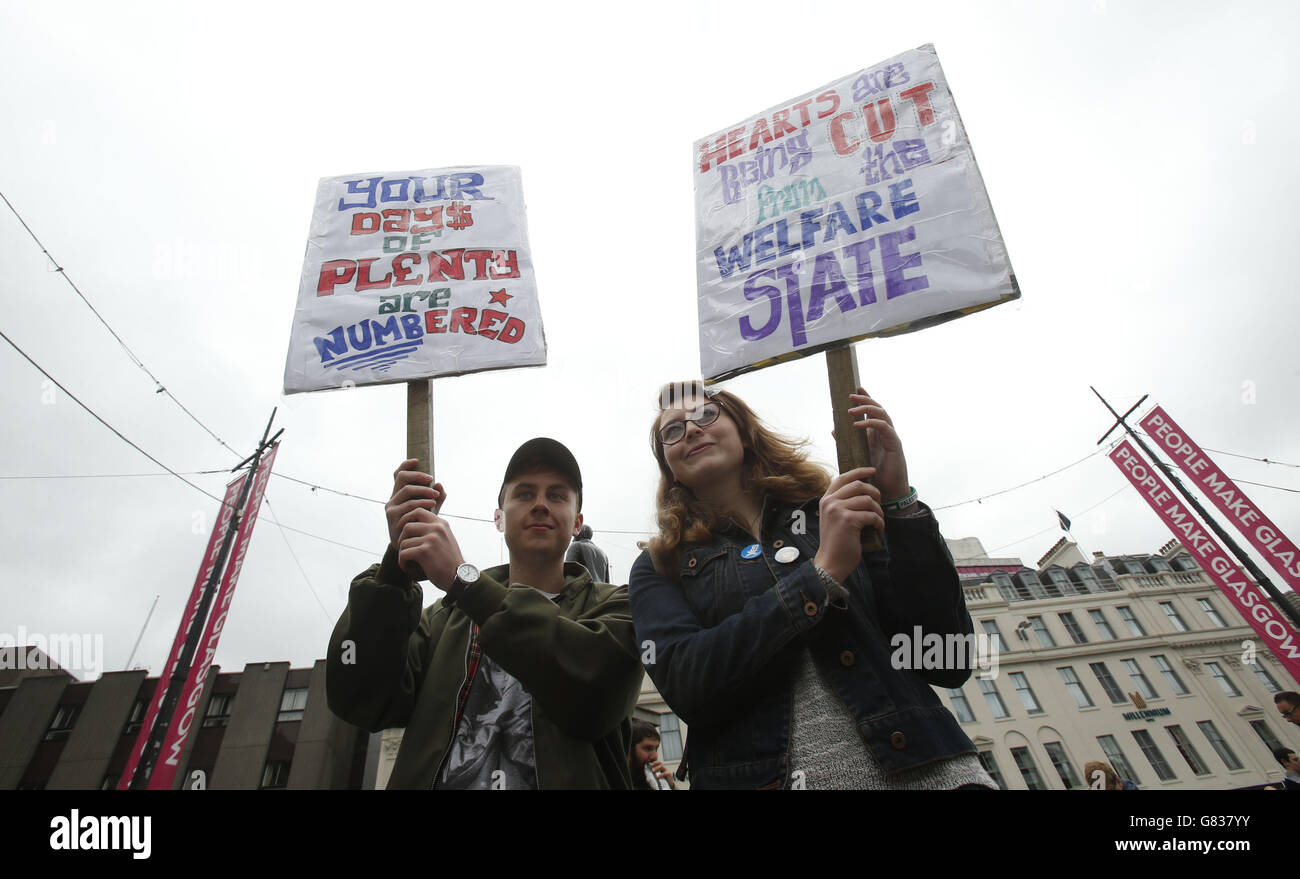 Micha Nye (left) and Martha Nye attend the Scotland United Against Austerity rally held in George Square, Glasgow. Stock Photo