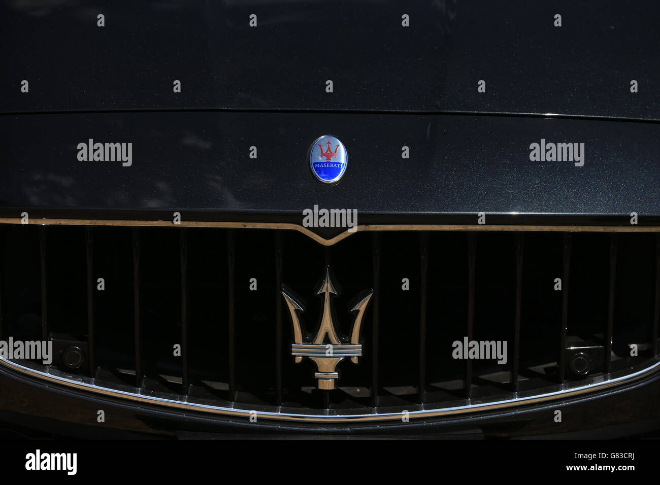 A Maseratti badge on the bonnet of a Maseratti. Stock Photo