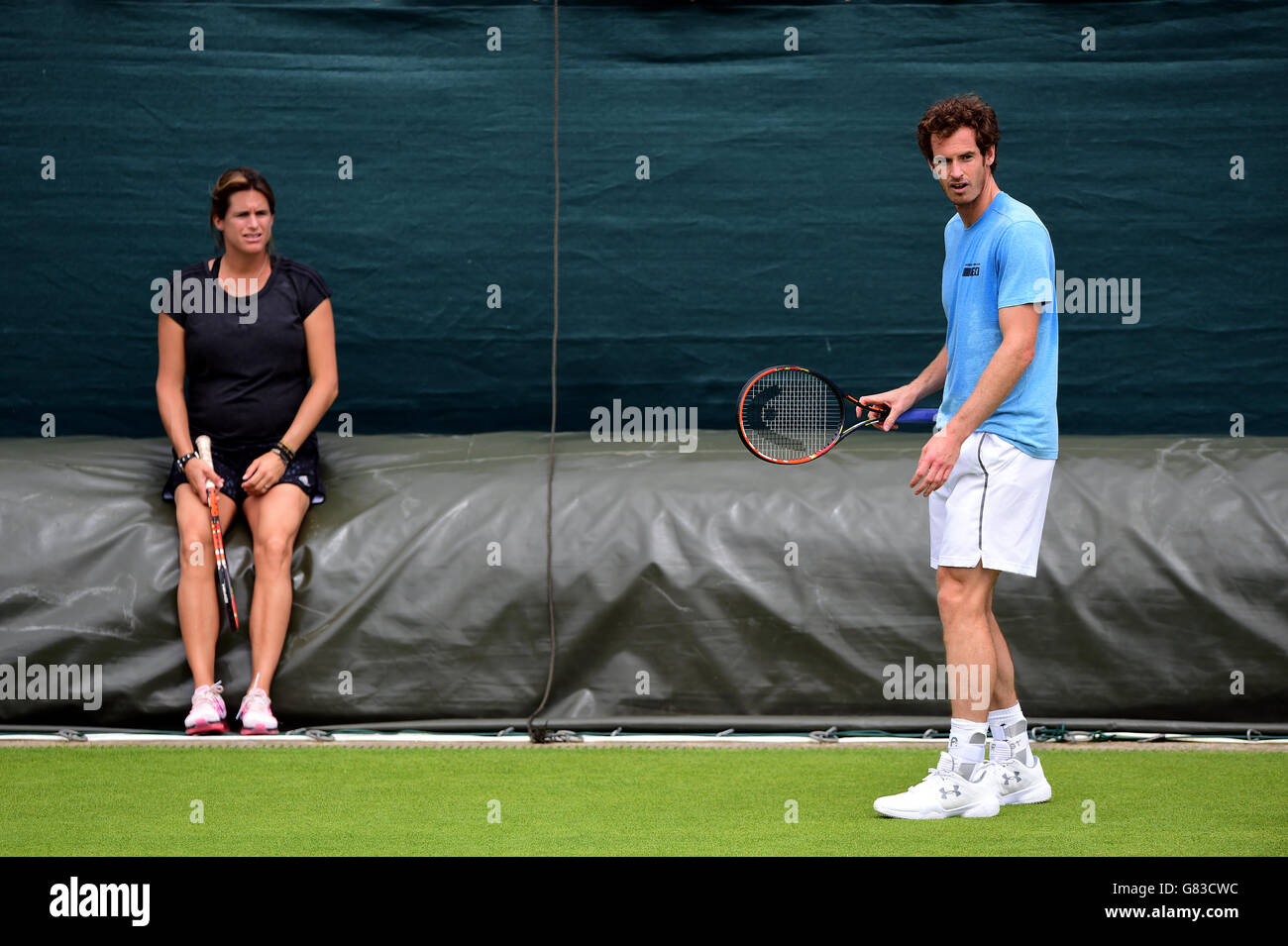 Andy Murray with Amelie Mauresmo (left) during practice on day one of the Wimbledon Championships at the All England Lawn Tennis and Croquet Club, Wimbledon. Stock Photo