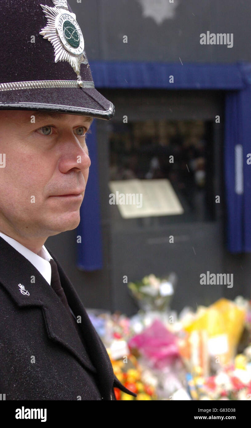 Police Constable Blandford from Staffordshire Police stands in front of the newly unveiled national memorial dedicated to police officers killed in the line of duty. Stock Photo