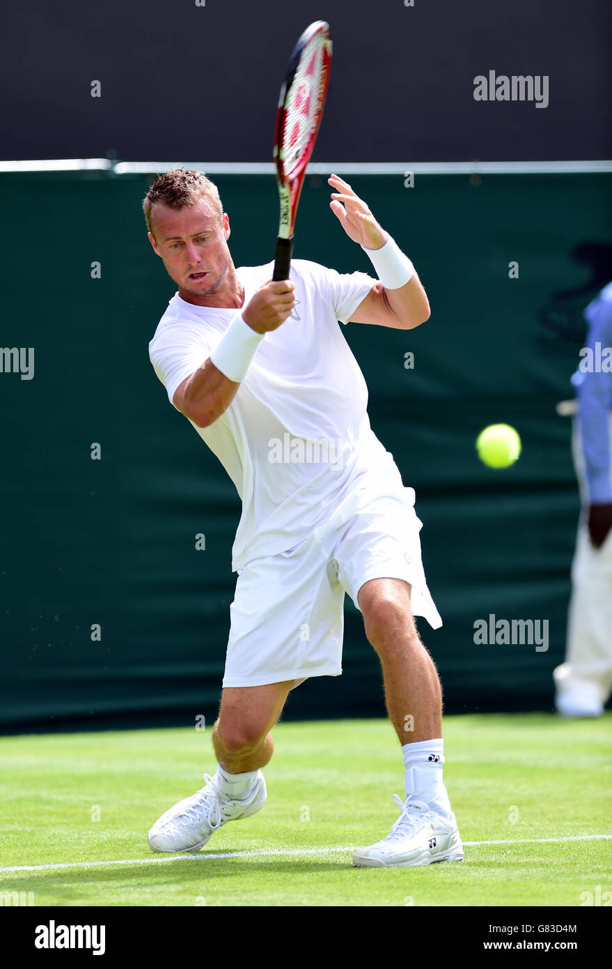 Lleyton Hewitt in action against Jarkko Nieminen during day one of the Wimbledon Championships at the All England Lawn Tennis and Croquet Club, Wimbledon. Stock Photo