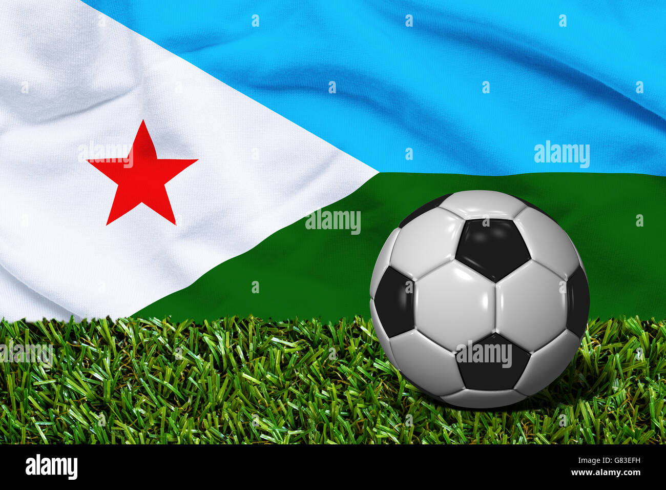 3D rendered soccer ball in grass field with Djibouti flag as Background Stock Photo