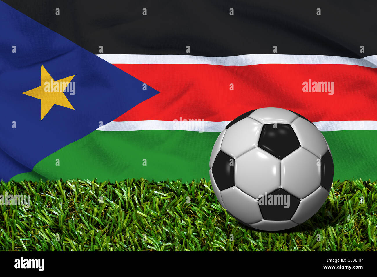3D rendered soccer ball in grass field with South Sudan flag as Background Stock Photo