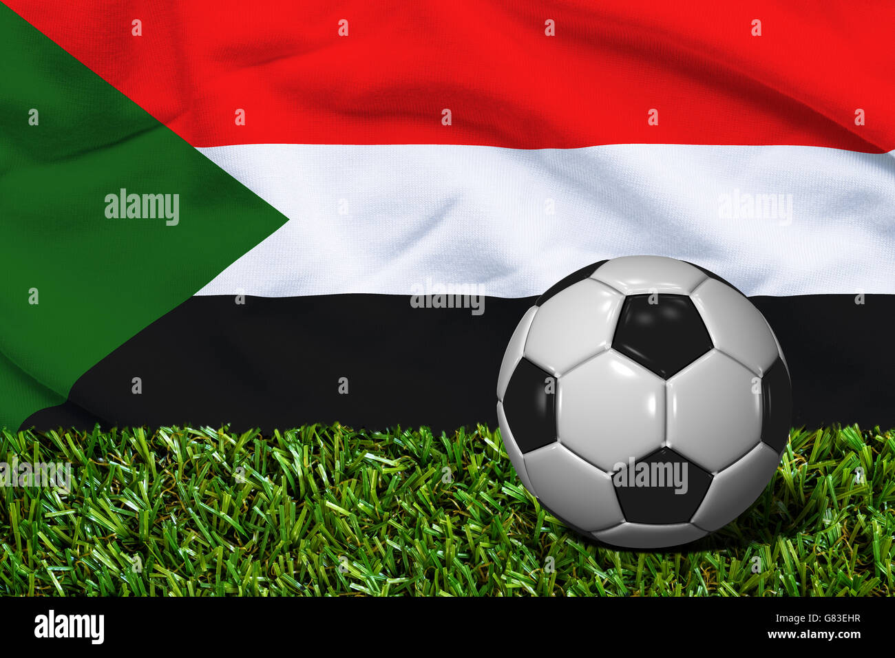 3D rendered soccer ball in grass field with Sudan flag as Background Stock Photo