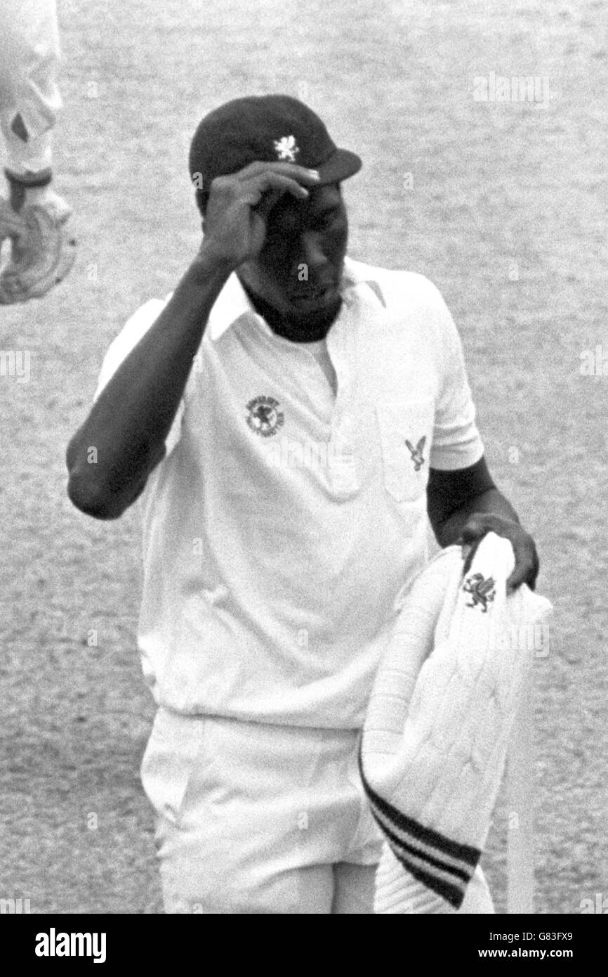 Somerset's Joel Garner replaces his cap after completing his maximum 11 overs with figures of 5 for 14 Stock Photo