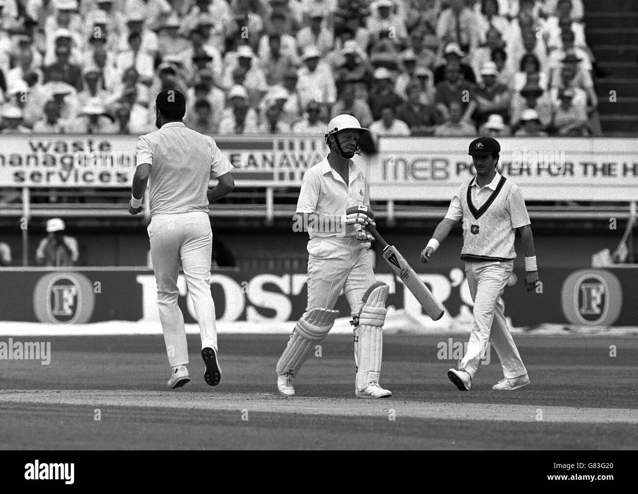 Bowler Merv Hughes (left) and a despondent Tim Curtis (right) leave the wicket after Curtis was caught by wicket-keeper Ian Healy at Egbaston in the third test. Stock Photo