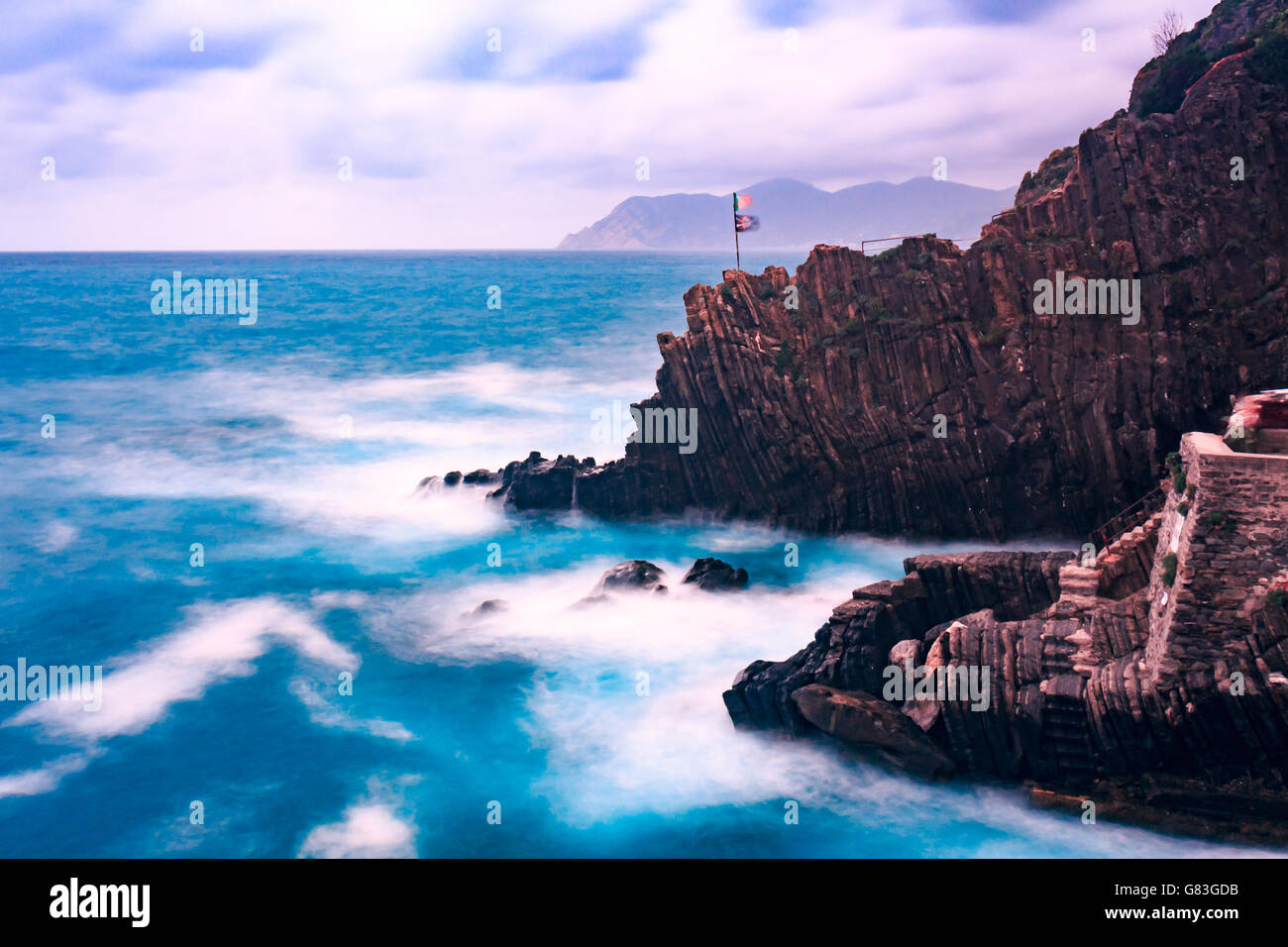 Stormy sea crashing on the coastal rocks in riomaggiore cinque terre italy Stock Photo