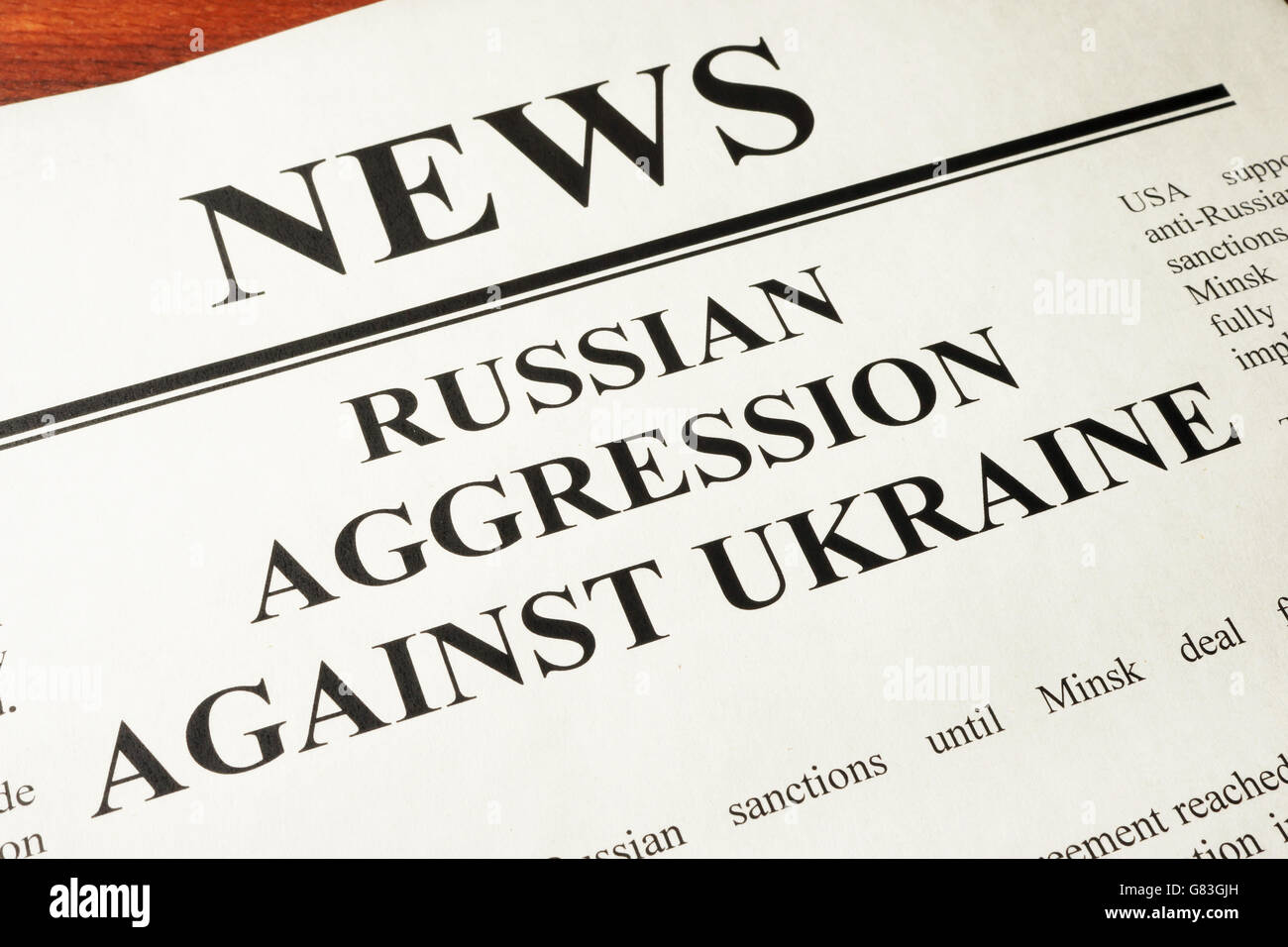 Newspaper with word news and Russian Aggression Against Ukraine. Stock Photo