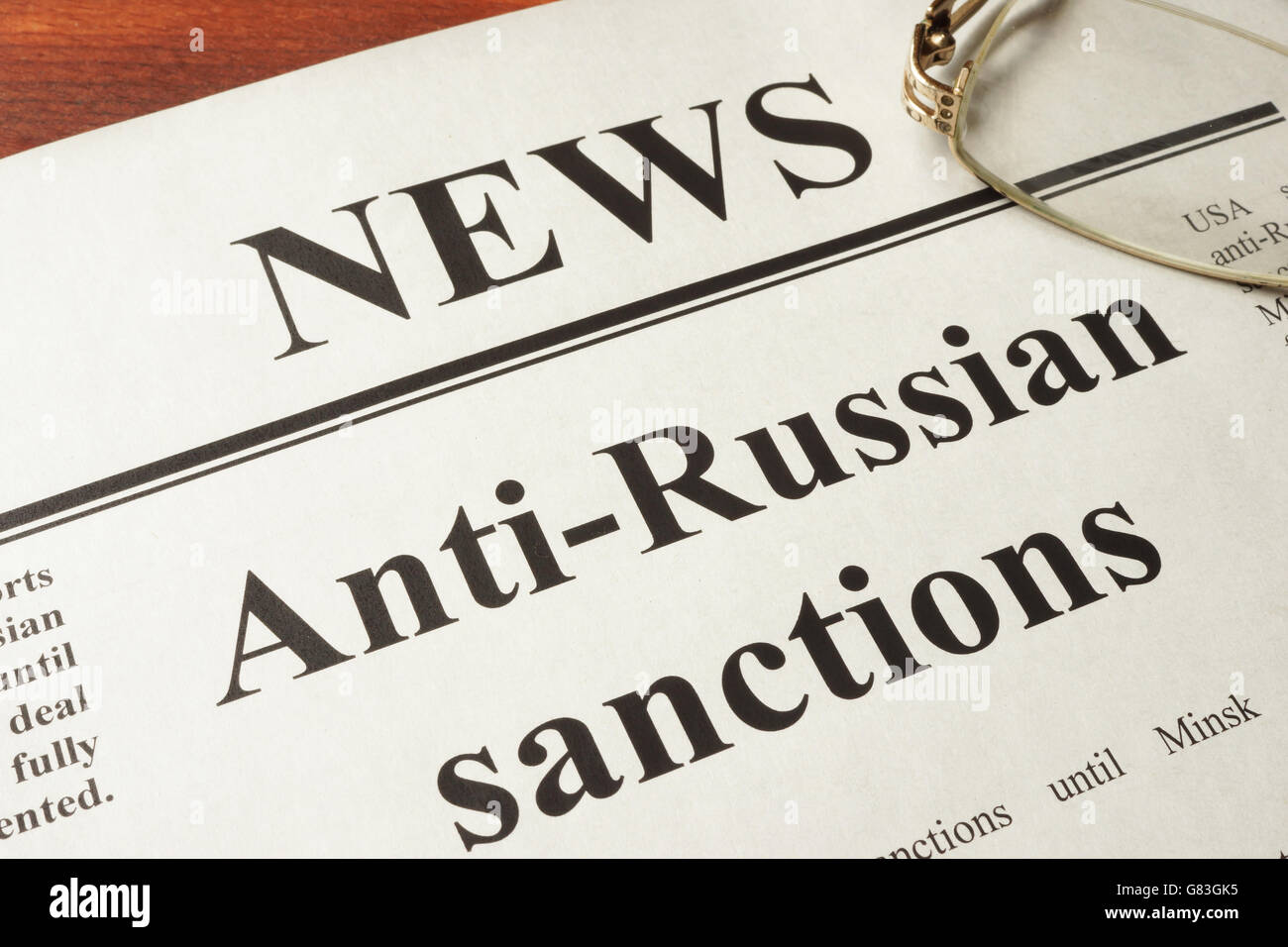 Newspaper with word news and Anti-Russian sanctions. Stock Photo