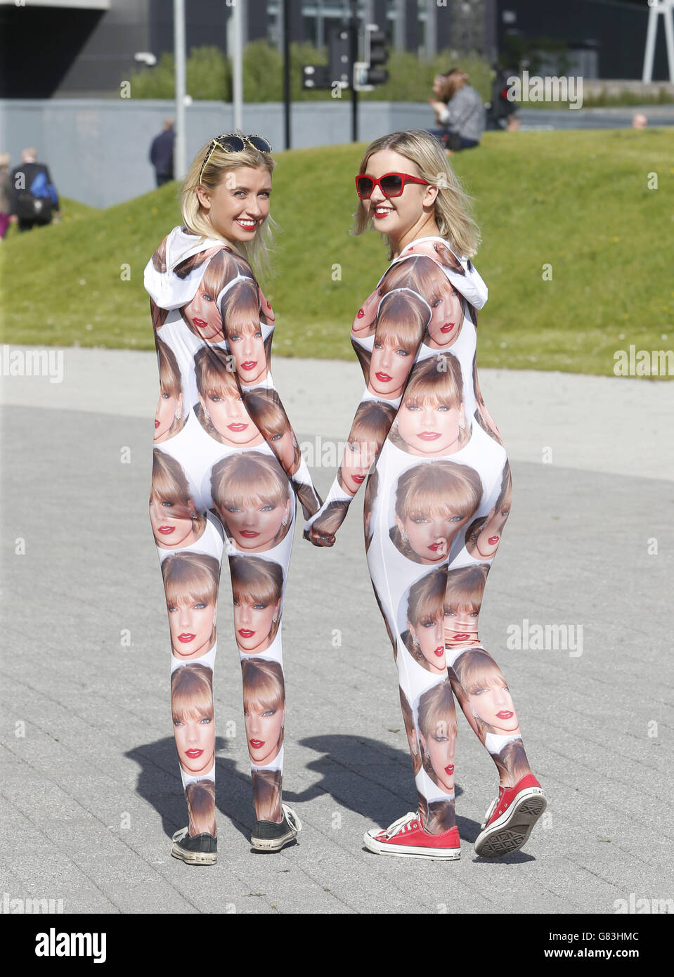 Fans Emma Robertson (left), 19 and Lucy Robertson, 17, outside the SSE Hydro, Glasgow, ahead of the first date on the Taylor Swift 1989 World Tour. Stock Photo