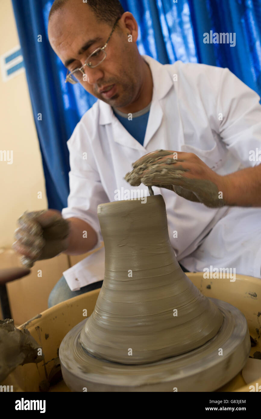 A student works in the pottery workshop at the Institute of Traditional Arts in Fez, Morocco. Stock Photo