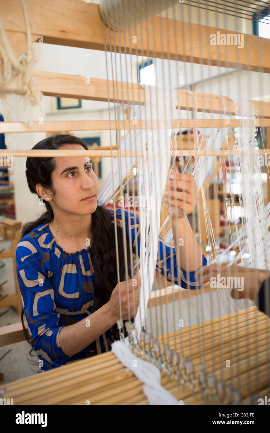 A student practices weaving at the Institute of Traditional Arts in Fez, Morocco. Stock Photo