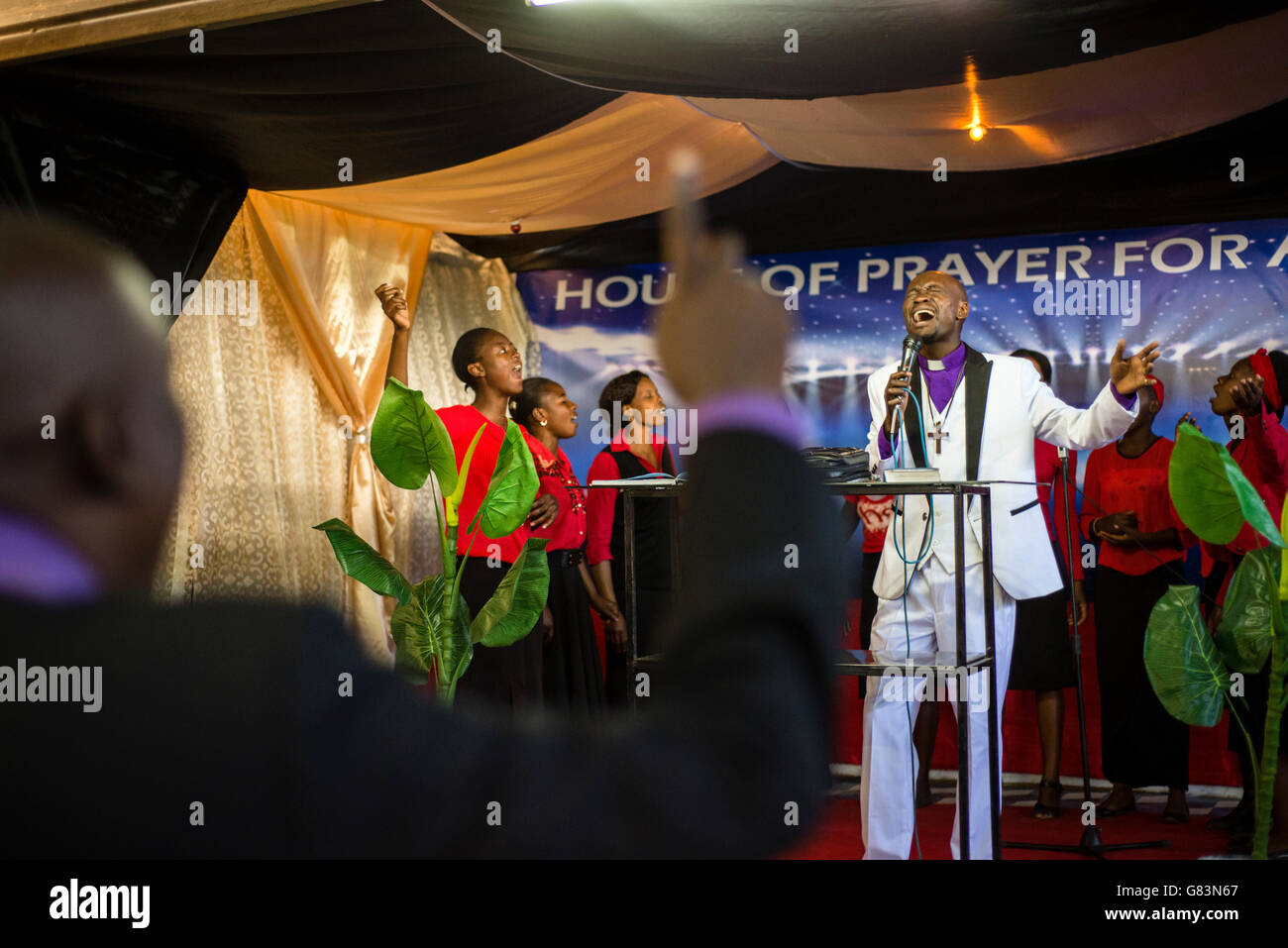 Prophet Chibwe Katebe sings the song for Jesus during a Sunday service at the House of Prayer for All Nations in Livingstone, Zambia. Stock Photo