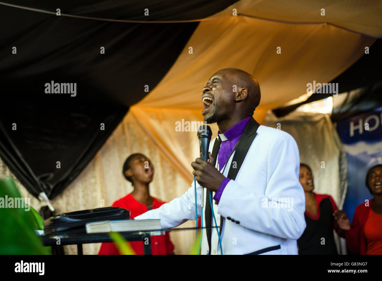 Prophet Chibwe Katebe sings the song for Jesus during a Sunday service at the House of Prayer for All Nations in Livingstone, Zambia. Stock Photo
