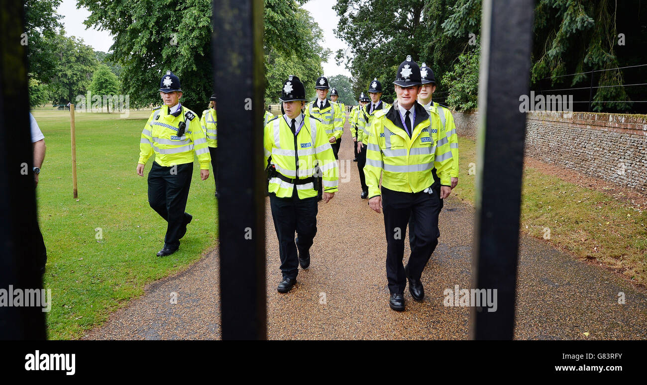 A group of Norfolk Police arrive to let through members of the public to the area around Church of St Mary Magdalene in Sandringham, Norfolk, as Princess Charlotte will be christened in front of the Queen and close family. Stock Photo