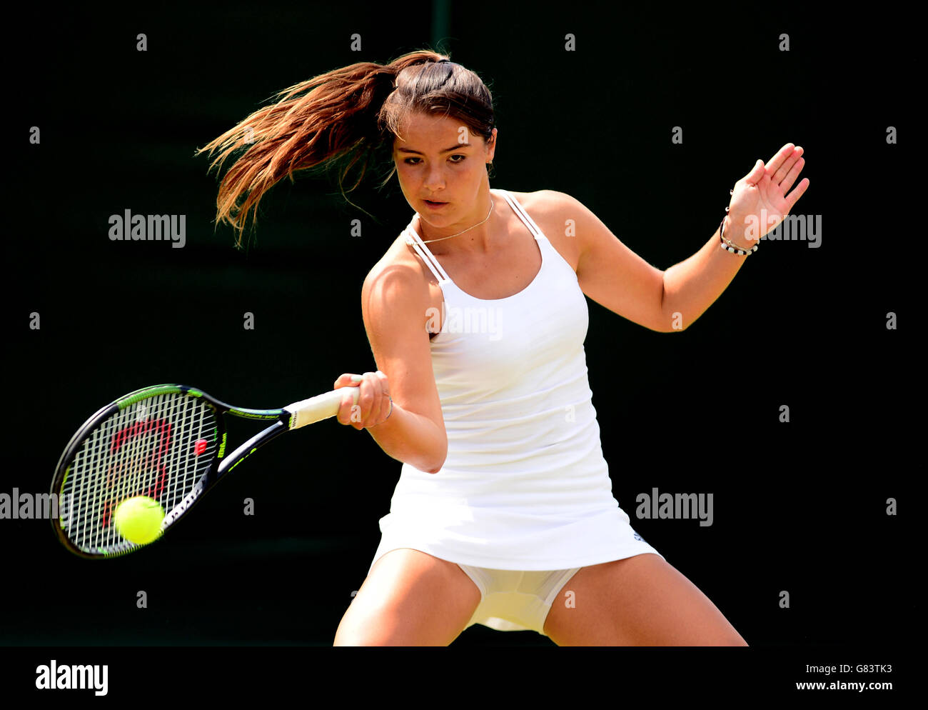 Jodie Anna Burrage competes in the girls singles on day Seven of the Wimbledon Championships at the All England Lawn Tennis and Croquet Club, Wimbledon. Stock Photo