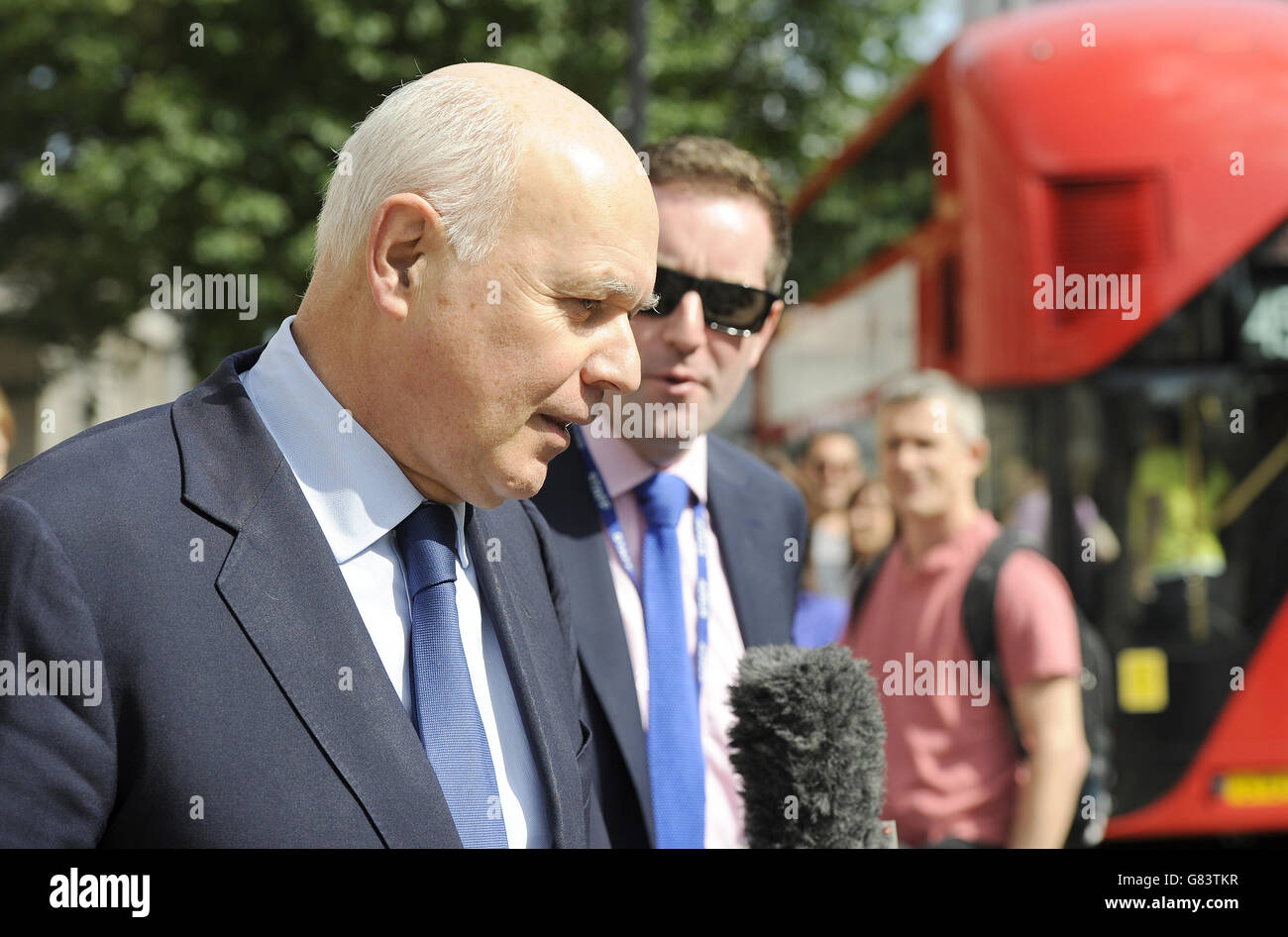 Work and Pensions Secretary Iain Duncan Smith leaves the Cabinet Office in Whitehall, London, as Prime Minister David Cameron chaired a meeting with Chancellor George Osborne, Bank of England governor Mark Carney and other senior officials to assess the likely impact of the Greek referendum vote to reject the austerity terms demanded by its international creditors on the UK. Stock Photo